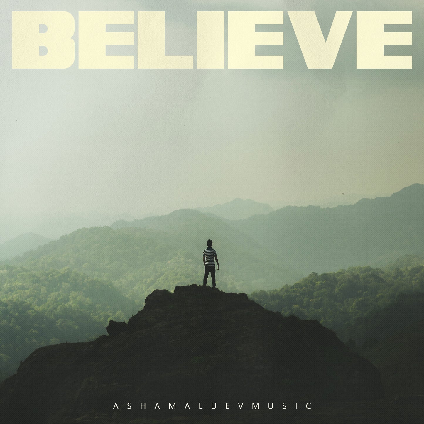 Cover art of the music track 'Believe' by AShamaluevMusic, which shows the man standing on a mountain