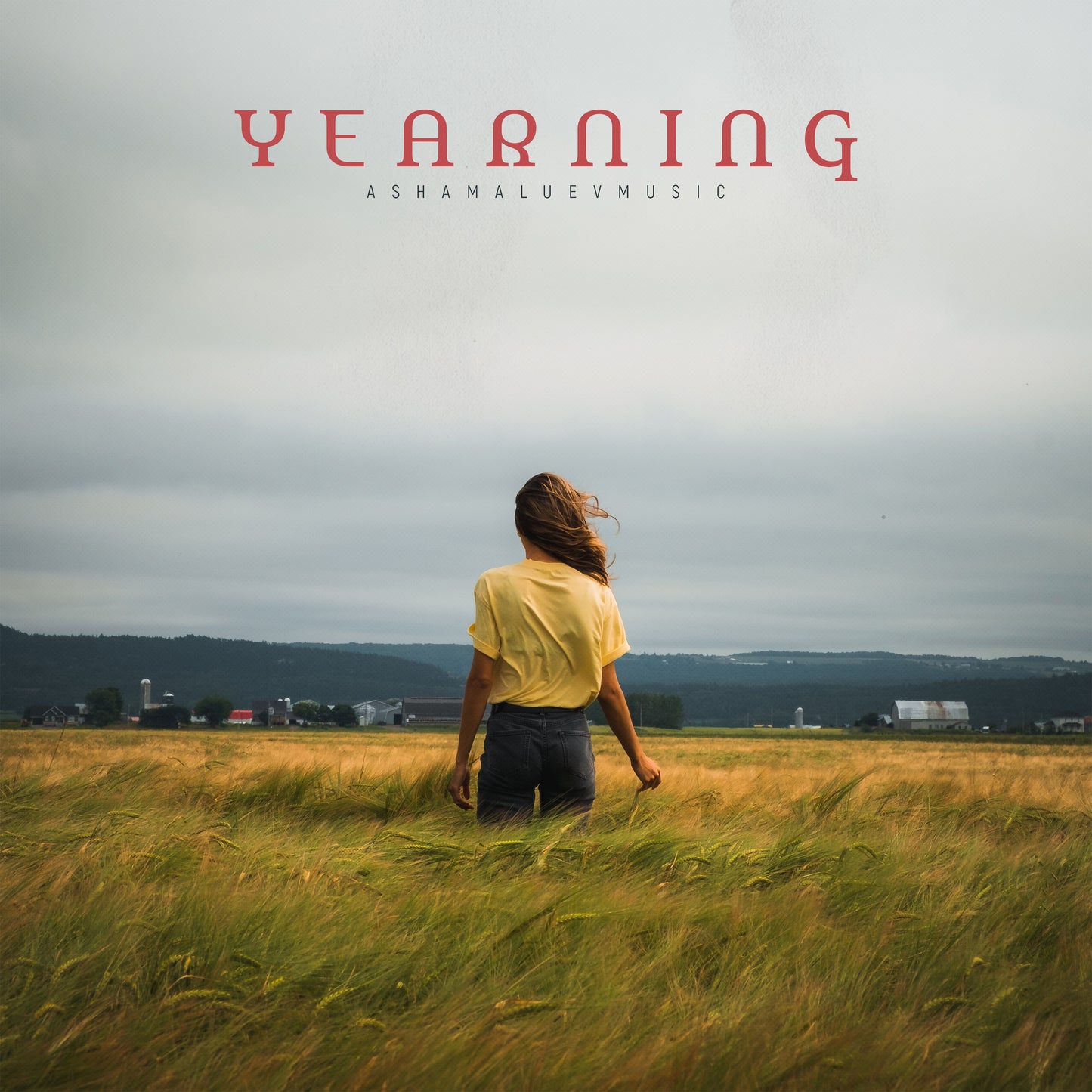 Cover art of the music track 'Yearning' by AShamaluevMusic, which shows the person standing in a field.