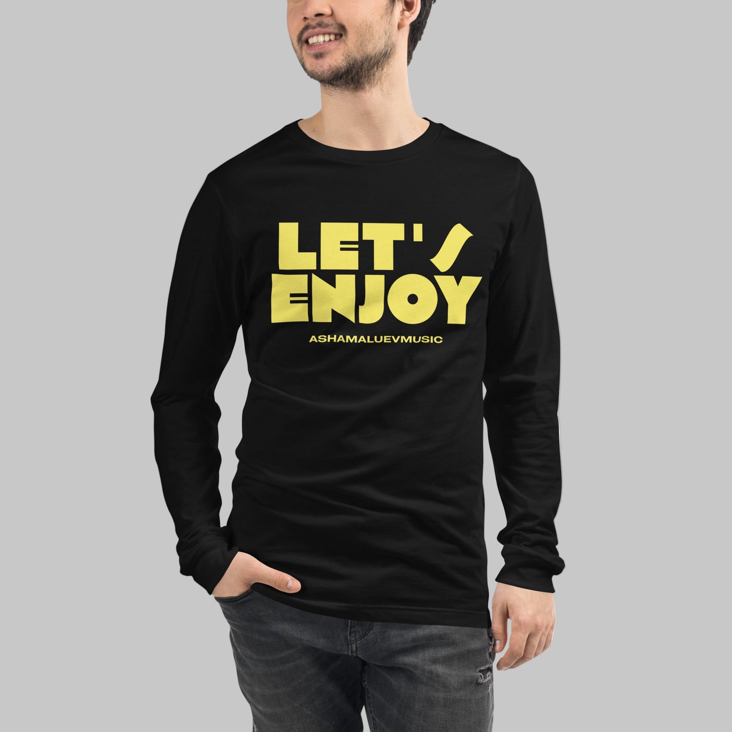 Person wearing a black long-sleeve shirt with yellow text 'LET'S ENJOY' and 'ASHAMALUEVMUSIC'.