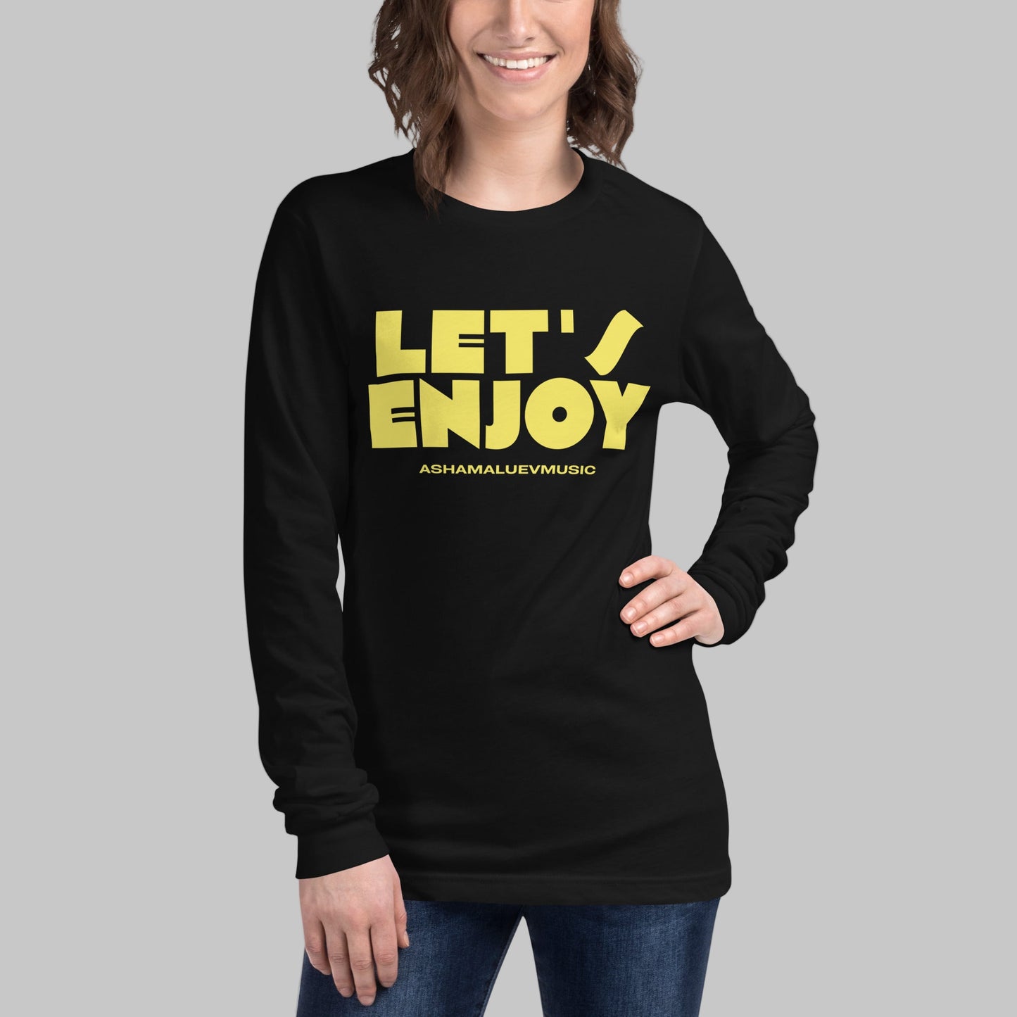 Person wearing a black long-sleeve shirt with yellow text on a grey background