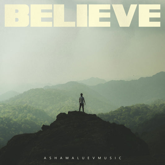 Cover art of the music track 'Believe' by AShamaluevMusic, which shows the man standing on a mountain