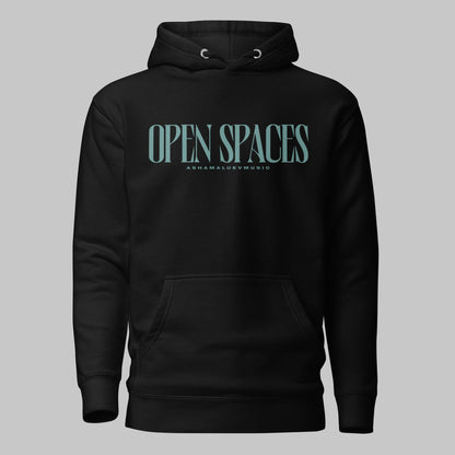 Black unisex premium hoodie with turquoise text 'Open Spaces' and 'AShamaluevMusic' on a gray background