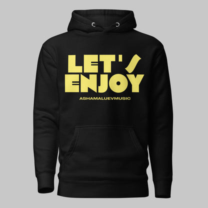 Black unisex pullover hoodie with yellow text 'LET'S ENJOY' and 'ASHAMALUEVMUSIC' on a gray background