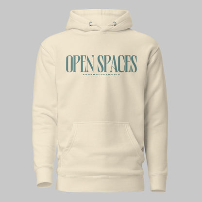 Bone unisex premium hoodie with turquoise text 'Open Spaces' and 'AShamaluevMusic' on a gray background