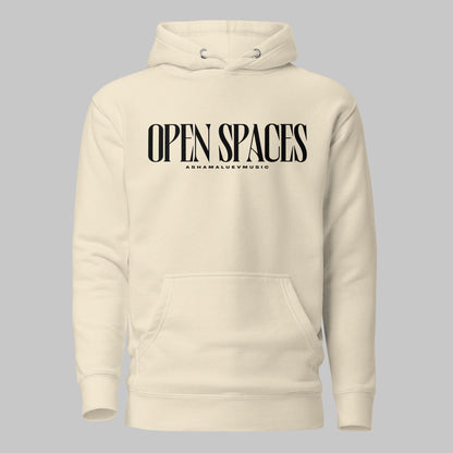 Bone unisex pullover premium hoodie with black text 'OPEN SPACES' and 'AShamaluevMusic' on a gray background.