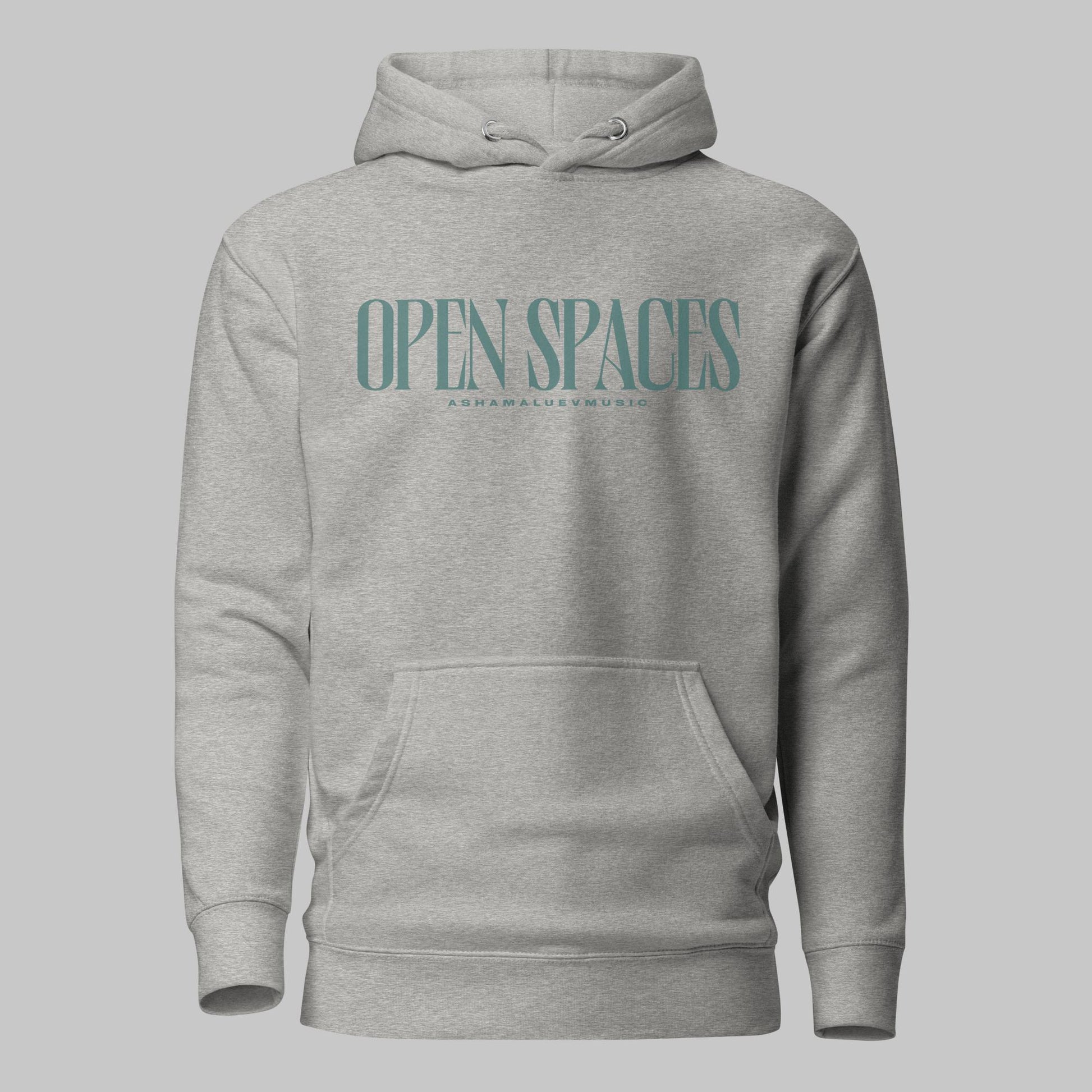 Carbon grey unisex premium hoodie with turquoise text 'Open Spaces' and 'AShamaluevMusic' on a gray background