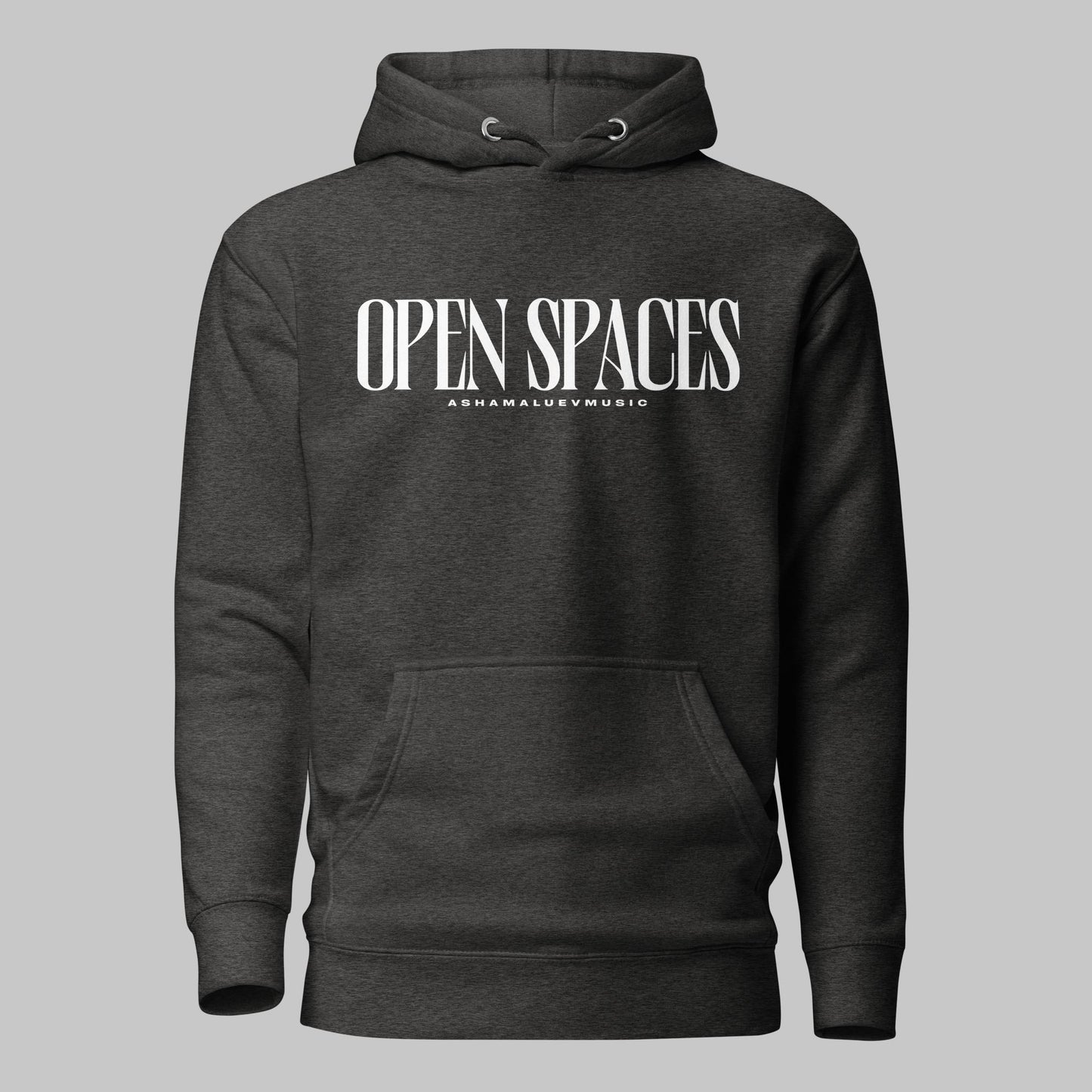 Charcoal heather unisex pullover premium hoodie with white text 'OPEN SPACES' and 'AShamaluevMusic' on a gray background.