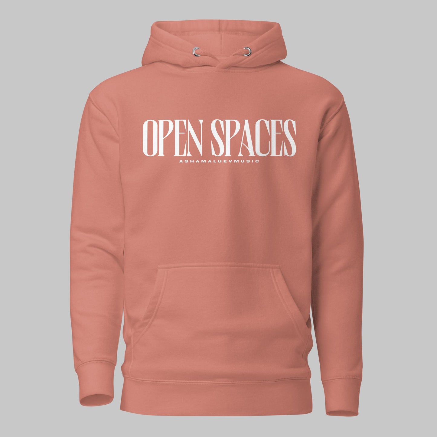 Dusty rose unisex pullover premium hoodie with white text 'OPEN SPACES' and 'AShamaluevMusic' on a gray background.