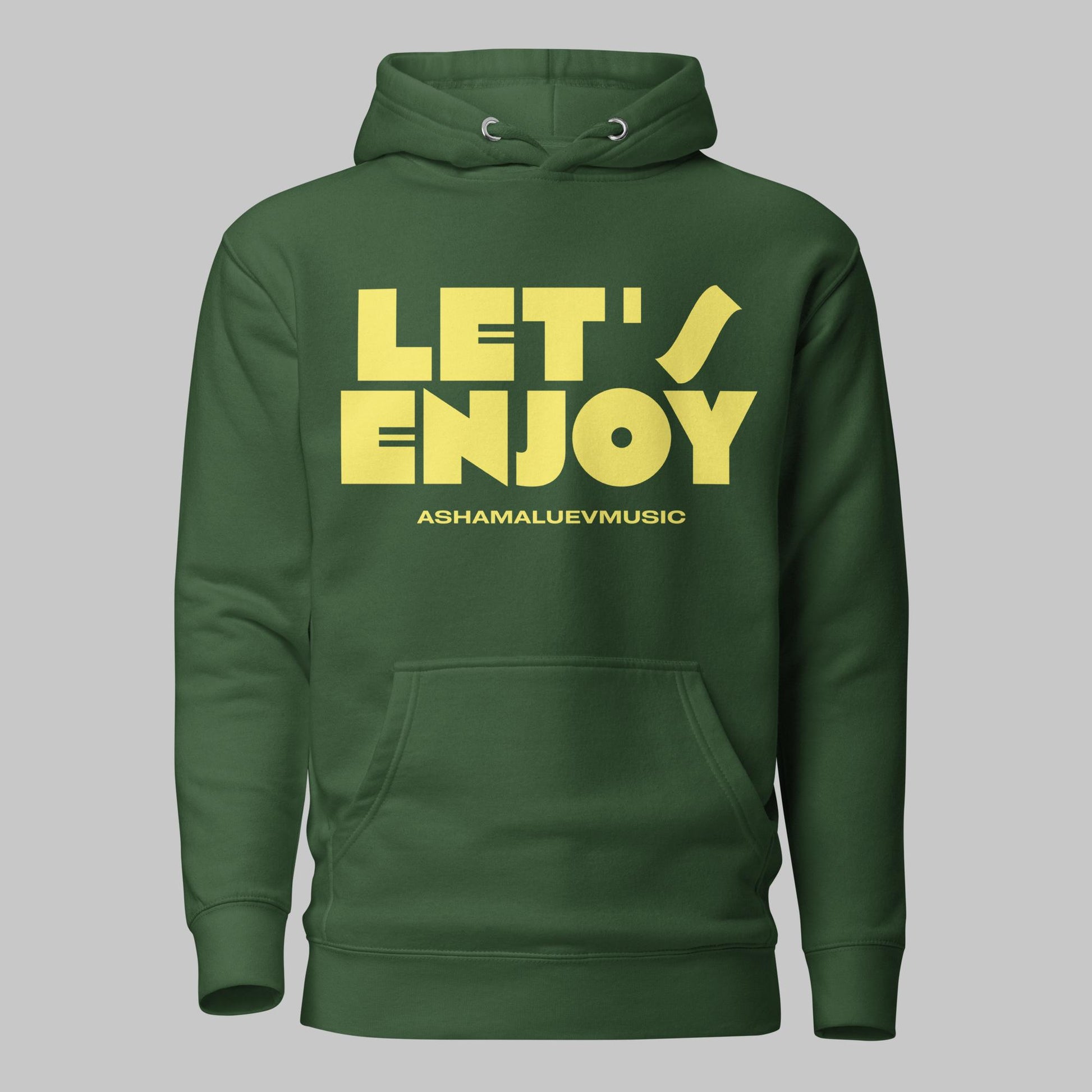 Forest green unisex pullover hoodie with yellow text 'LET'S ENJOY' and 'ASHAMALUEVMUSIC' on a gray background.