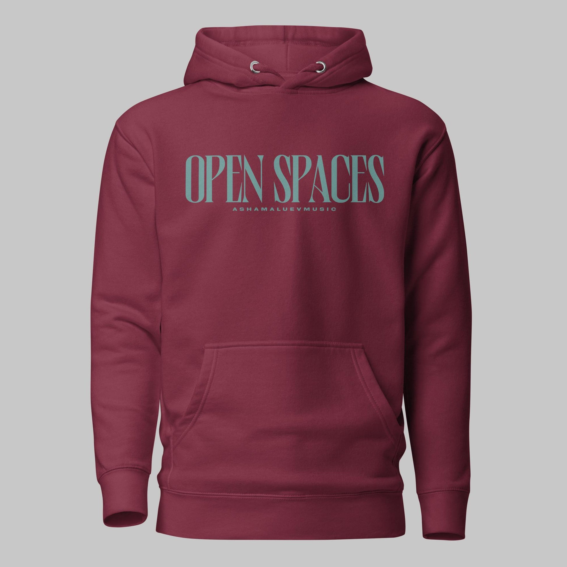 Maroon unisex premium hoodie with turquoise text 'Open Spaces' and 'AShamaluevMusic' on a gray background