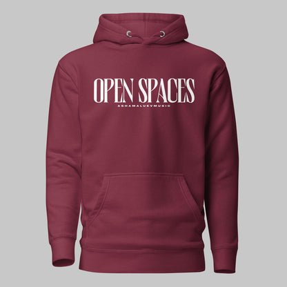 Maroon unisex pullover premium hoodie with white text 'OPEN SPACES' and 'AShamaluevMusic' on a gray background.