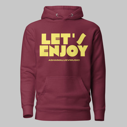 Maroon unisex pullover hoodie with yellow text 'LET'S ENJOY' and 'ASHAMALUEVMUSIC' on a gray background.