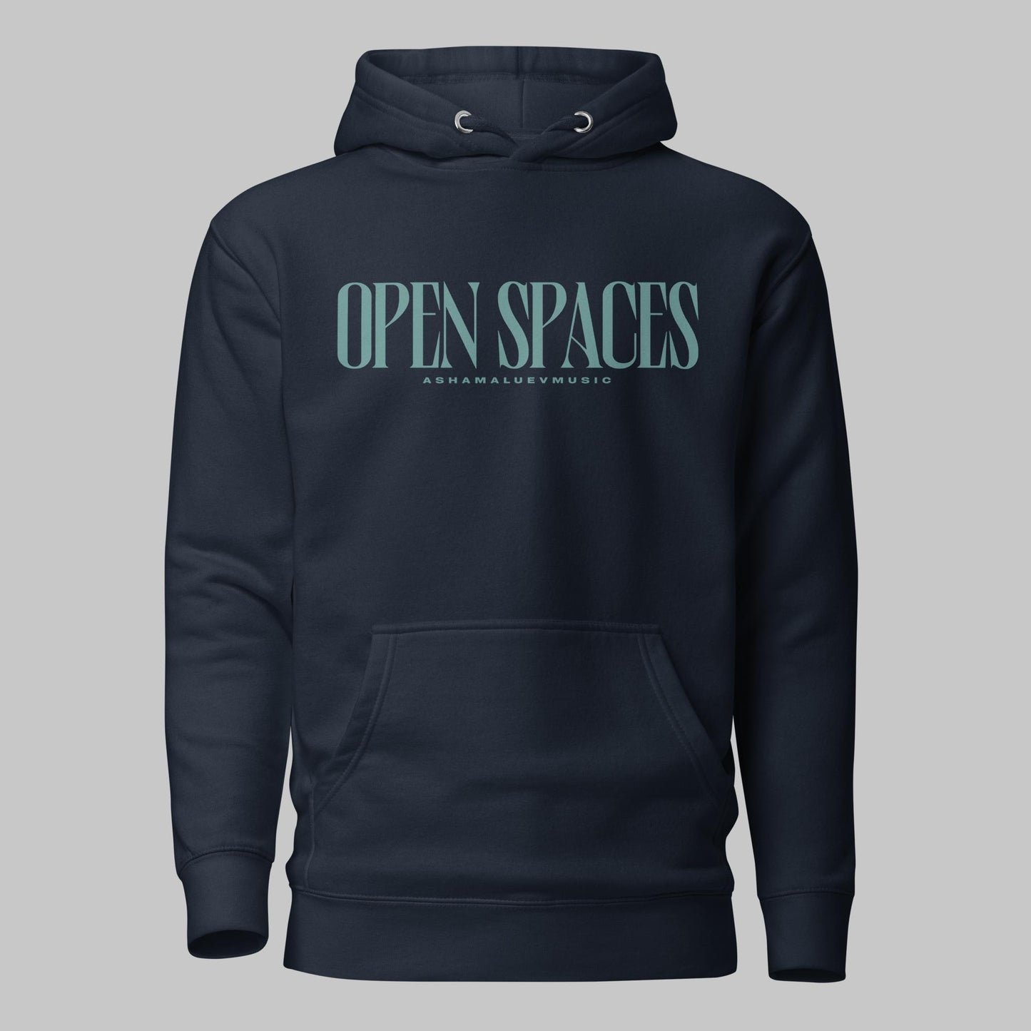 Navy blazer unisex premium hoodie with turquoise text 'Open Spaces' and 'AShamaluevMusic' on a gray background