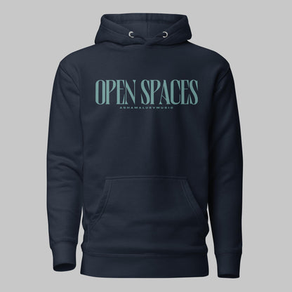 Navy blazer unisex premium hoodie with turquoise text 'Open Spaces' and 'AShamaluevMusic' on a gray background
