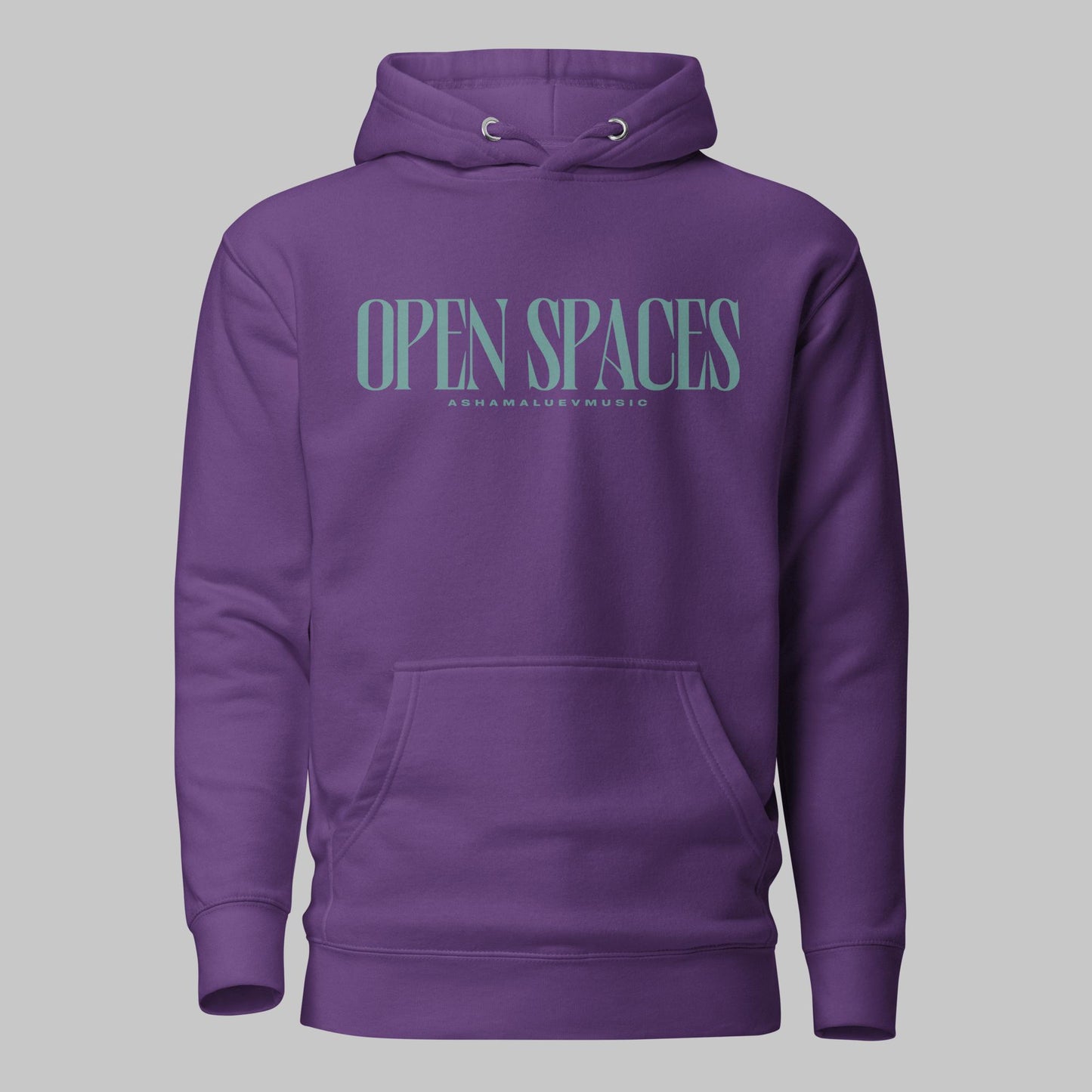 Purple unisex premium hoodie with turquoise text 'Open Spaces' and 'AShamaluevMusic' on a gray background
