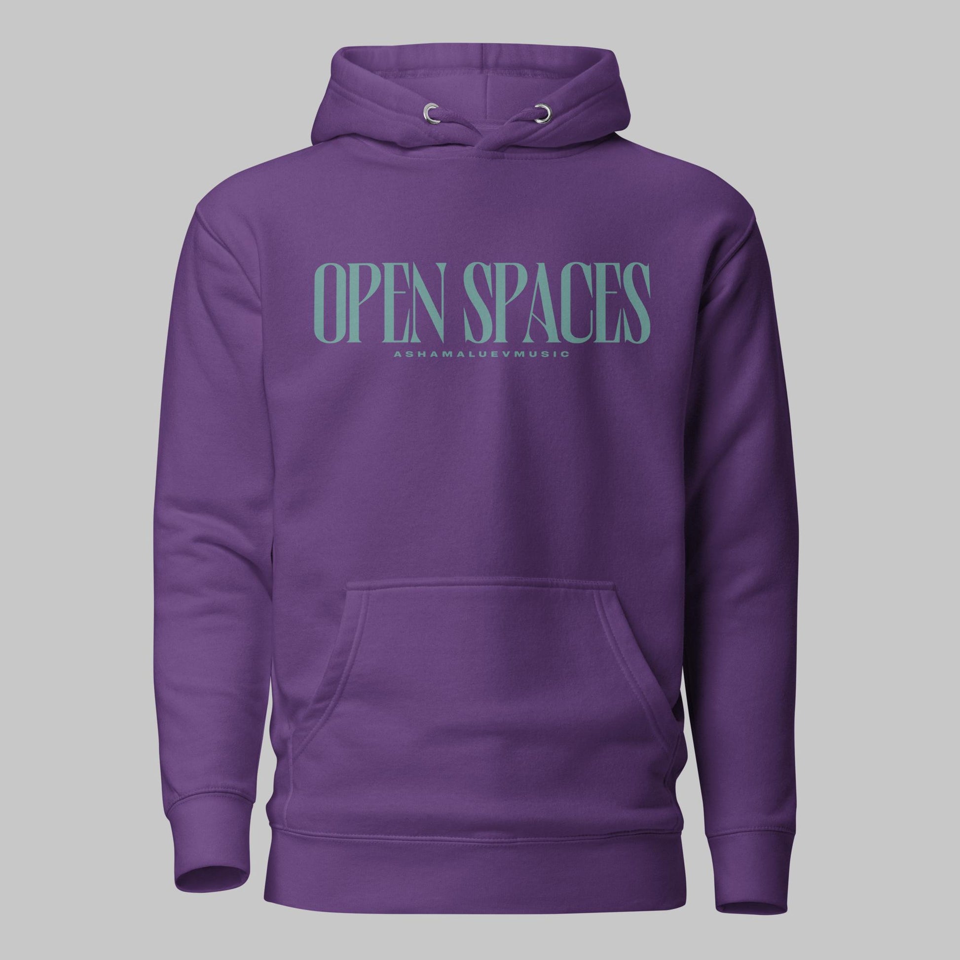 Purple unisex premium hoodie with turquoise text 'Open Spaces' and 'AShamaluevMusic' on a gray background