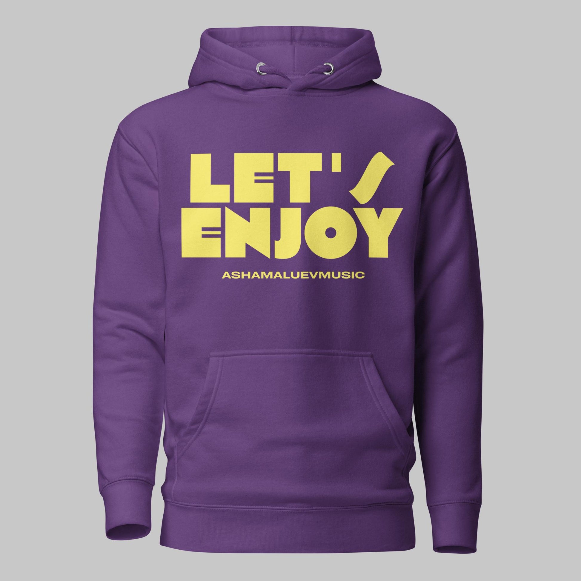 Purple unisex pullover hoodie with yellow text 'LET'S ENJOY' and 'ASHAMALUEVMUSIC' on a gray background.