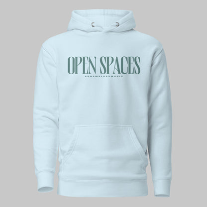 Sky blue unisex premium hoodie with turquoise text 'Open Spaces' and 'AShamaluevMusic' on a gray background