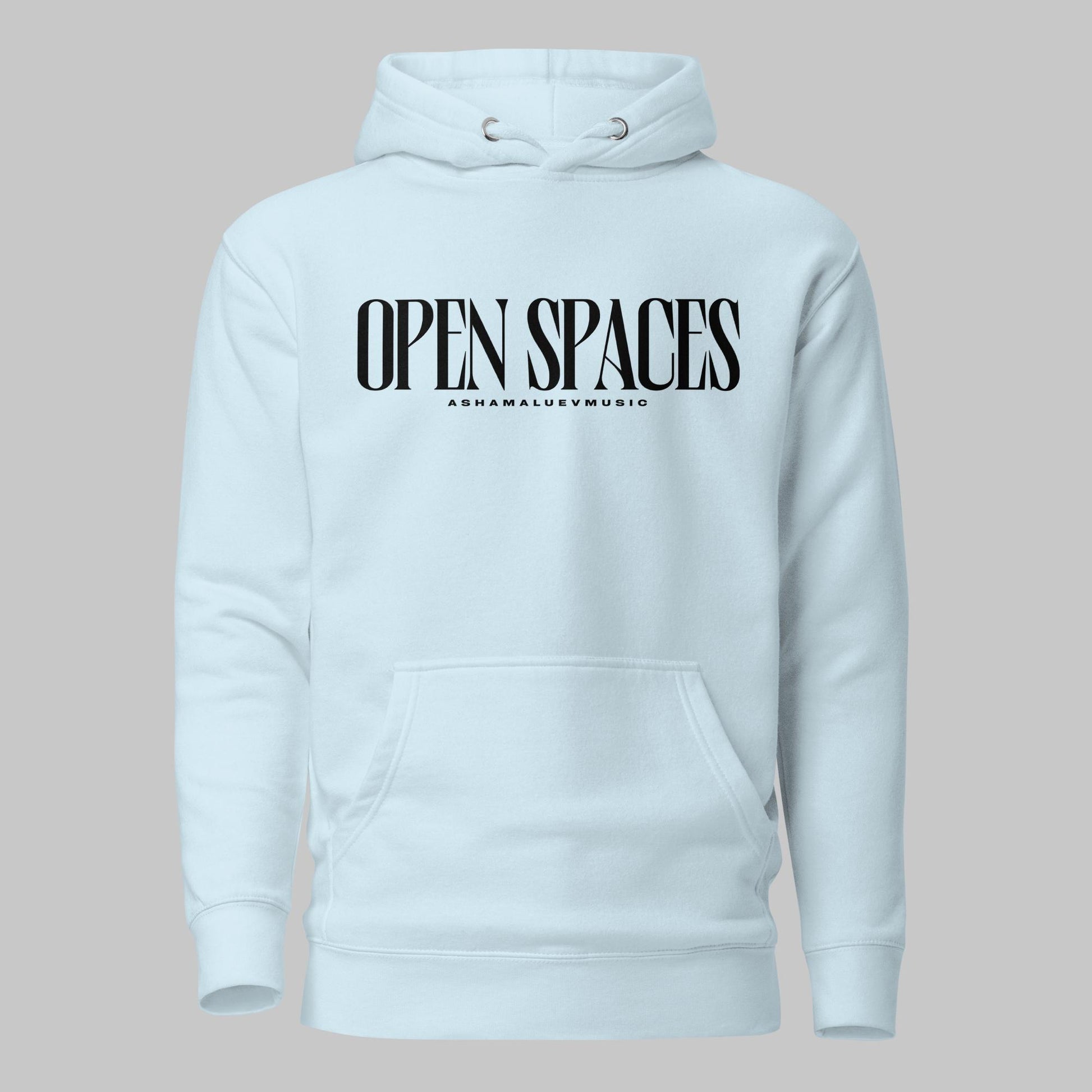 Sky blue unisex pullover premium hoodie with black text 'OPEN SPACES' and 'AShamaluevMusic' on a gray background.