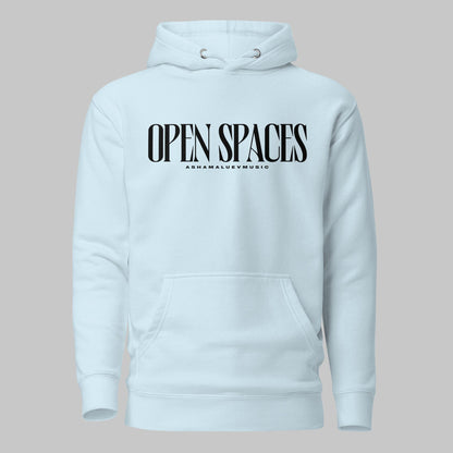 Sky blue unisex pullover premium hoodie with black text 'OPEN SPACES' and 'AShamaluevMusic' on a gray background.