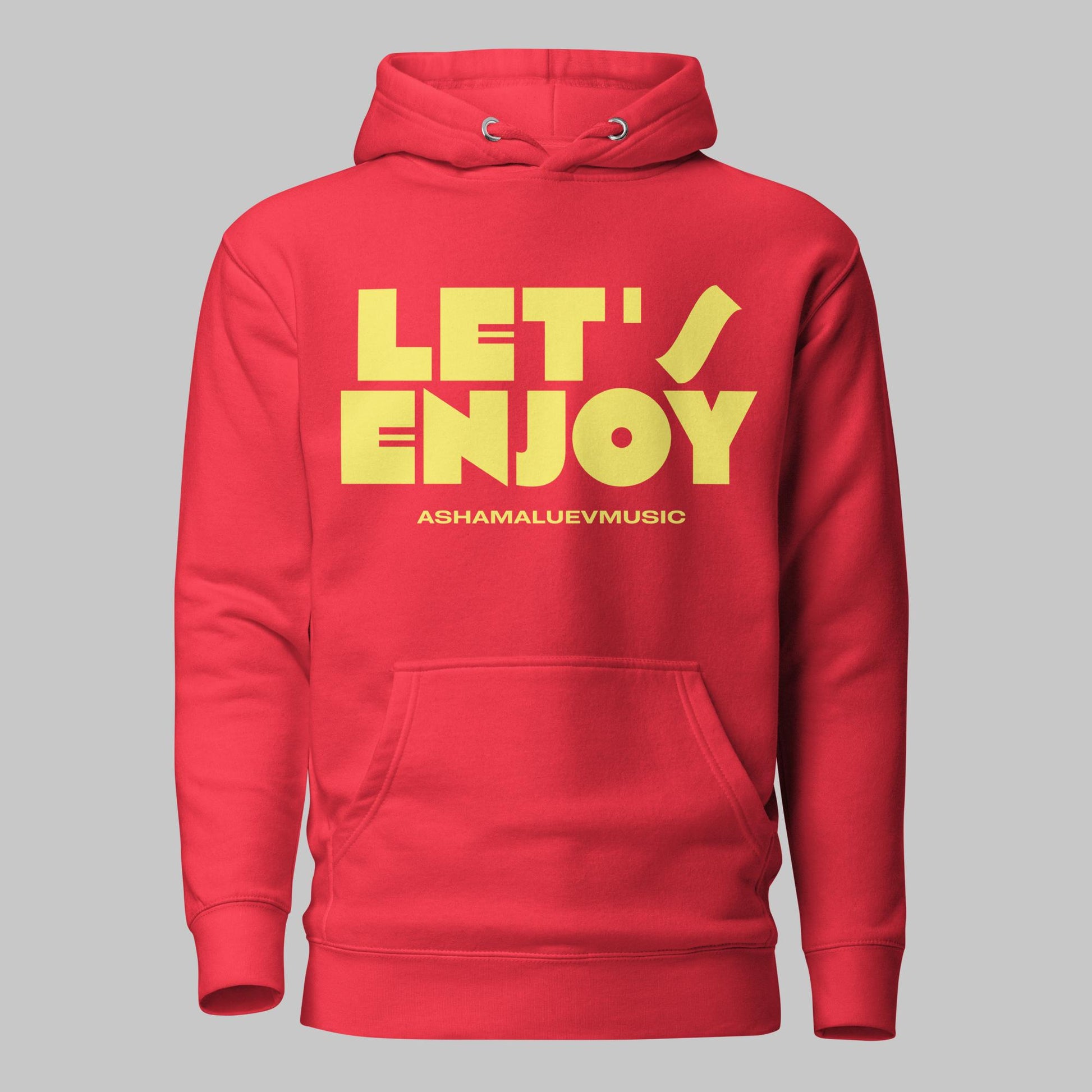 Team red unisex pullover hoodie with yellow text 'LET'S ENJOY' and 'ASHAMALUEVMUSIC' on a gray background.