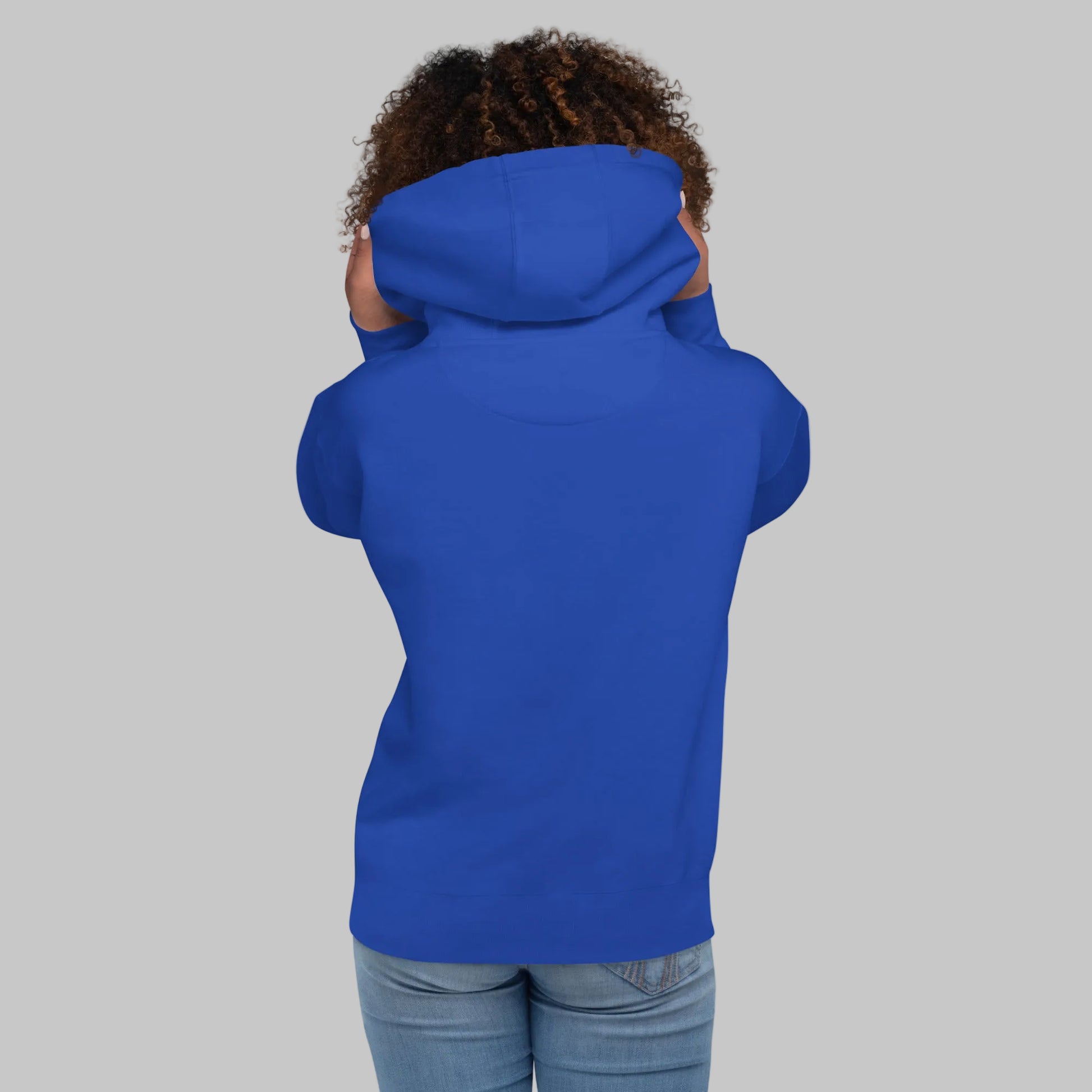 Woman wearing a blue hoodie from behind on a white background