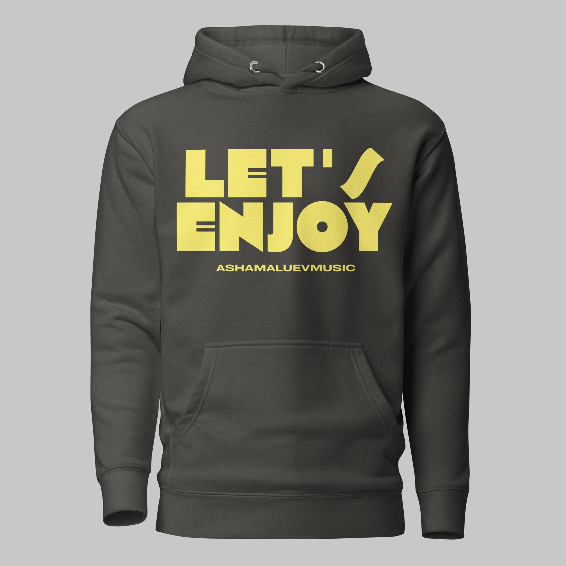 Vintage black unisex pullover hoodie with yellow text 'LET'S ENJOY' and 'ASHAMALUEVMUSIC' on a gray background.