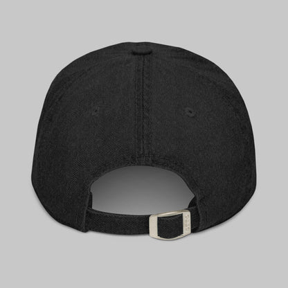 Black denim cap on a gray background