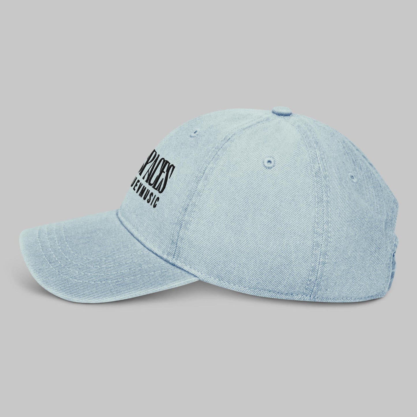 Light blue denim cap with black text 'Open Spaces' and 'AShamaluevMusic' on a gray background
