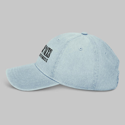 Light blue denim cap with black text 'Open Spaces' and 'AShamaluevMusic' on a gray background