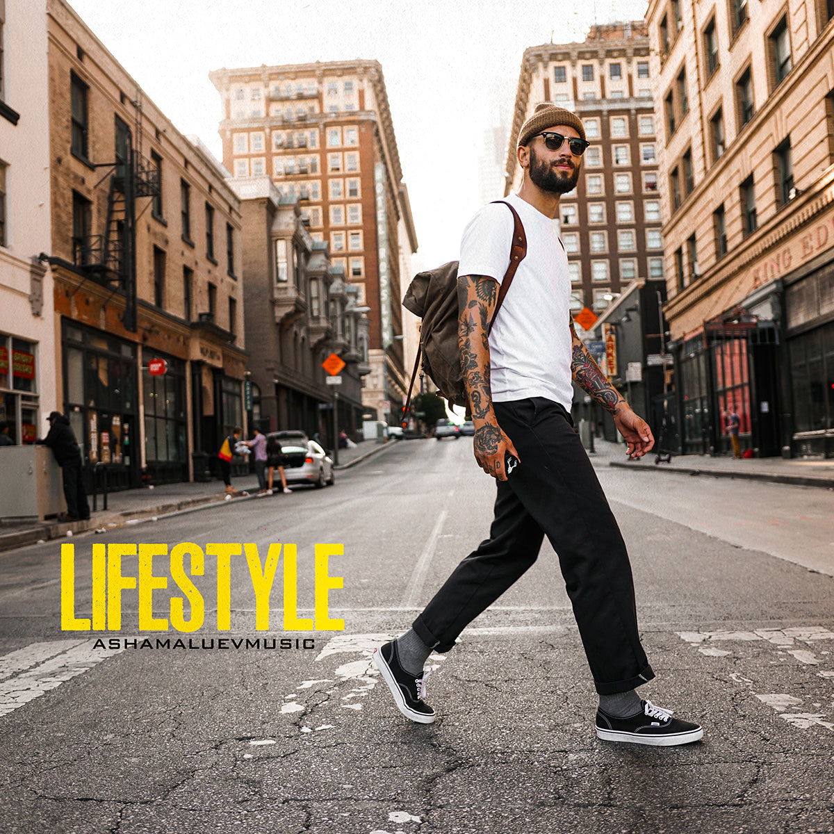 Cover art of the music track 'Lifestyle' by AShamaluevMusic, which shows the man walking on a city street.