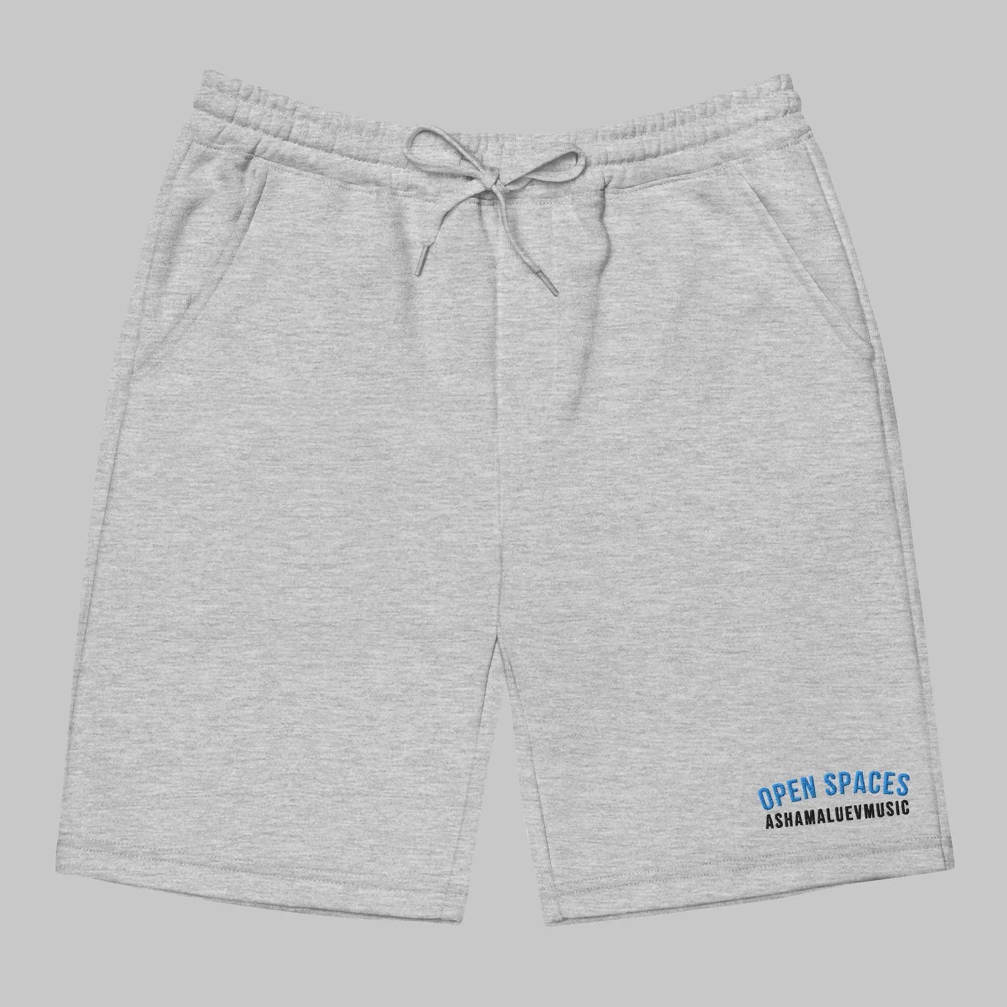Gray men's fleece shorts with 'Open Spaces' and 'AShamaluevMusic' logo on a gray background