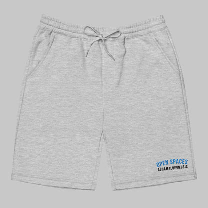 Gray men's fleece shorts with 'Open Spaces' and 'AShamaluevMusic' logo on a gray background