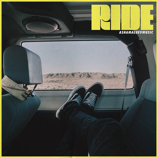 Cover art of the music track 'Ride' by AShamaluevMusic, which shows the person's feet resting on a car dashboard with a desert view.