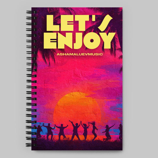 Notebook with a vibrant design featuring a sunset and people dancing, with 'Let's Enjoy' text and 'ASHAMALUEVMUSIC' branding.