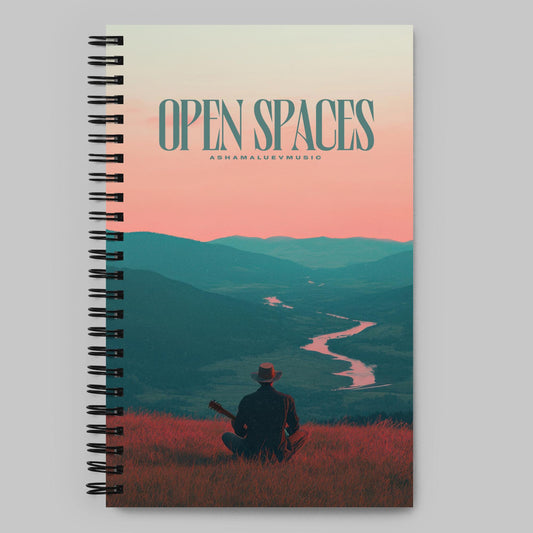 Notebook with 'Open Spaces' and 'AShamaluevMusic' cover design featuring a person with a guitar and mountains.