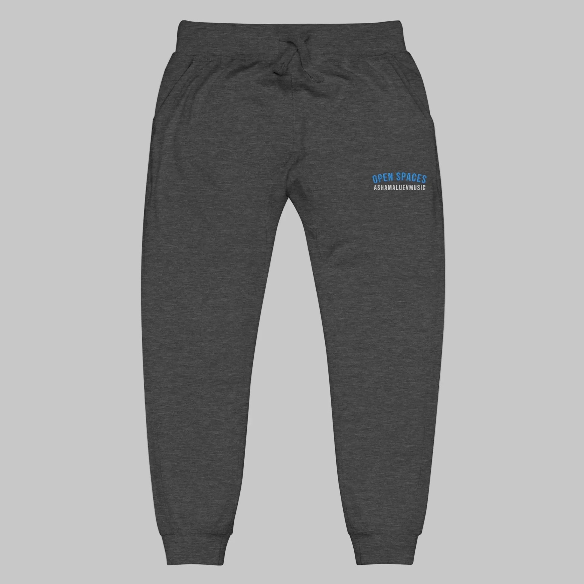 Dark gray sweatpants with 'Open Spaces' and 'AShamaluevMusic' embroidered on a gray background