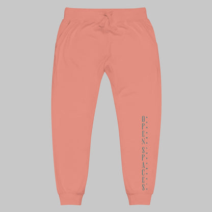 Dusty rose unisex fleece sweatpants with turquoise text 'Open Spaces' and 'AShamaluevMusic' on a gray background.