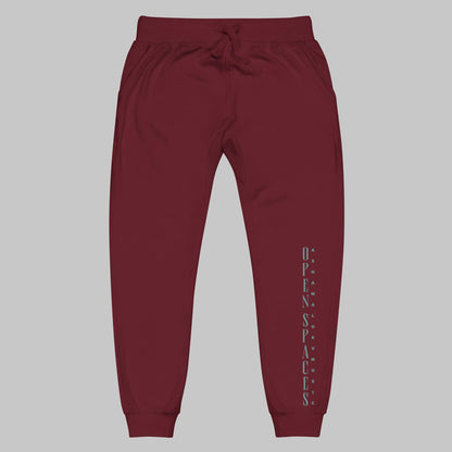 Maroon unisex fleece sweatpants with turquoise text 'Open Spaces' and 'AShamaluevMusic' on a gray background.