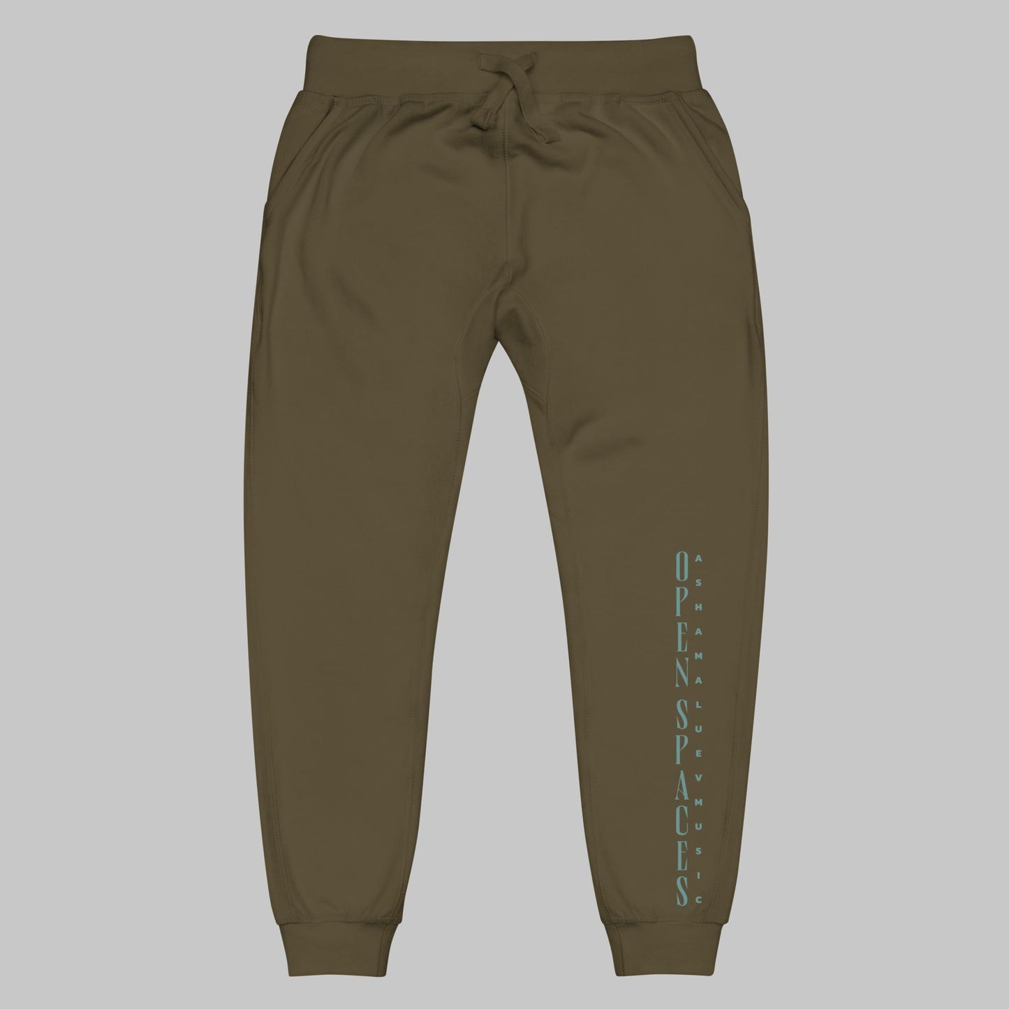 Military green unisex fleece sweatpants with turquoise text 'Open Spaces' and 'AShamaluevMusic' on a gray background.
