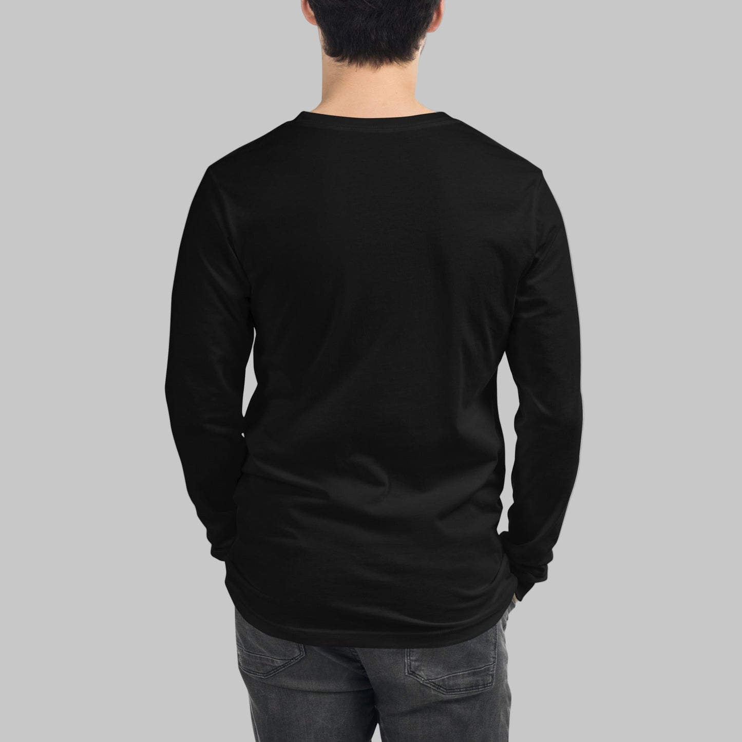 Person wearing a black long-sleeve shirt on a grey background