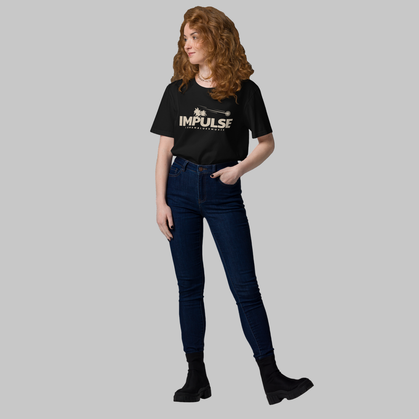 Woman wearing a black t-shirt with 'IMPULSE' and AShamaluevMusic logo on a grey background