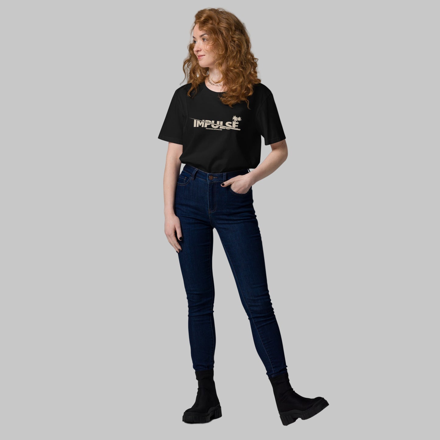 Woman wearing a black t-shirt with text 'IMPULSE' and AShamaluevMusic logo on a grey background