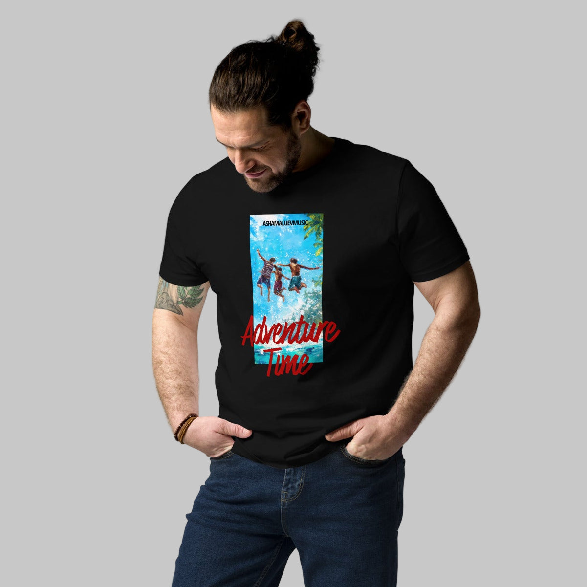 Man wearing a black t-shirt with 'Adventure Time' graphic design and AShamaluevMusic logo on a grey background.