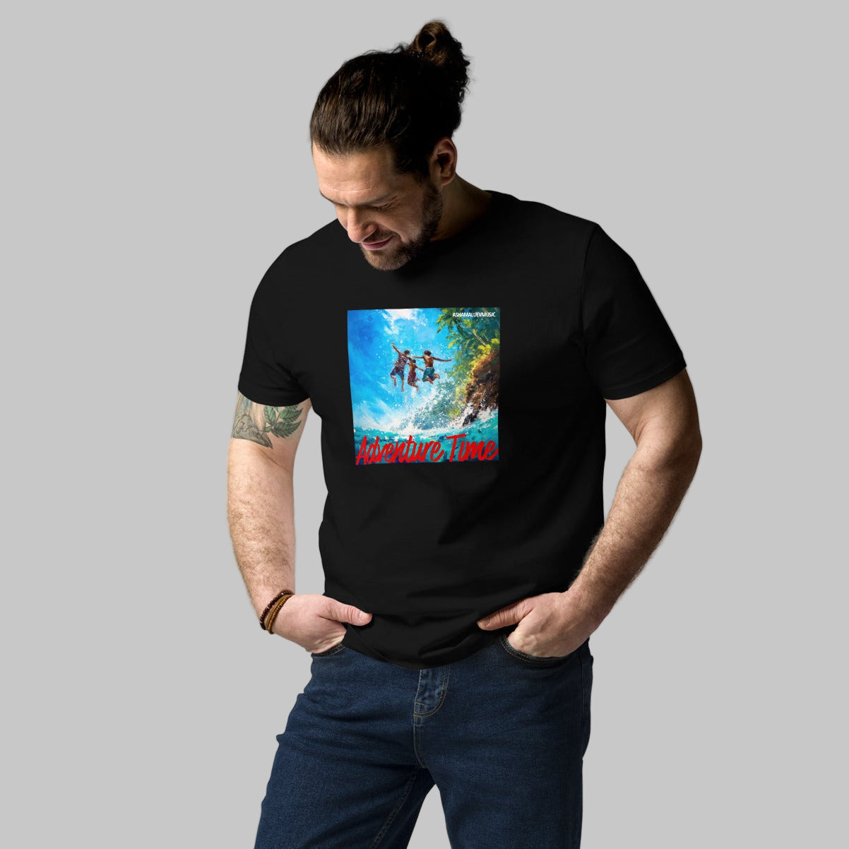 Man wearing a black t-shirt with a 'Adventure Time' graphic design and AShamaluevMusic logo on a grey background.