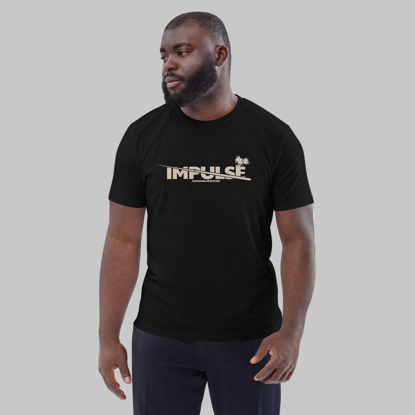 Man wearing a black t-shirt with text 'IMPULSE' and AShamaluevMusic logo on a grey background