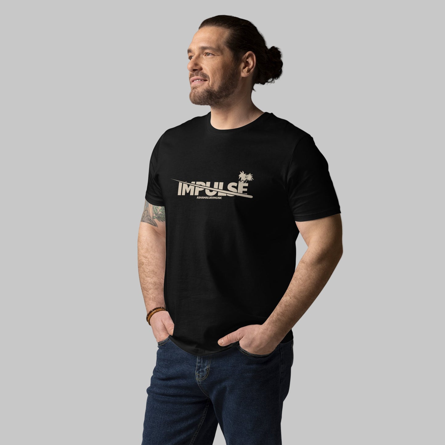 Man wearing a black t-shirt with text 'IMPULSE' and AShamaluevMusic logo on a grey background