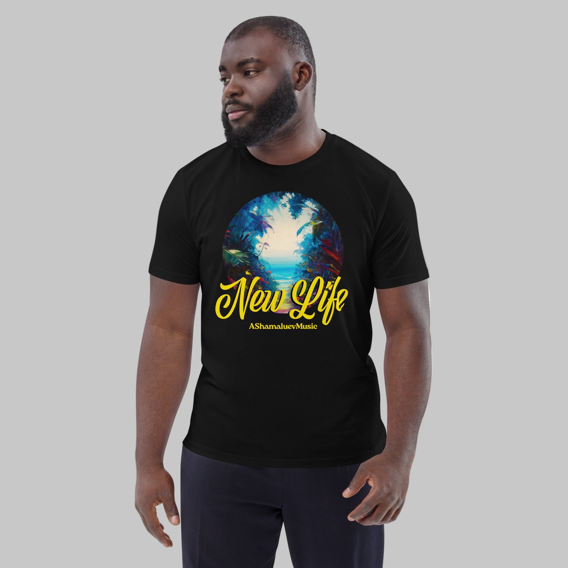 Man wearing a black organic cotton t-shirt with 'New Life' print and AShamaluevMusic logo on a light grey background