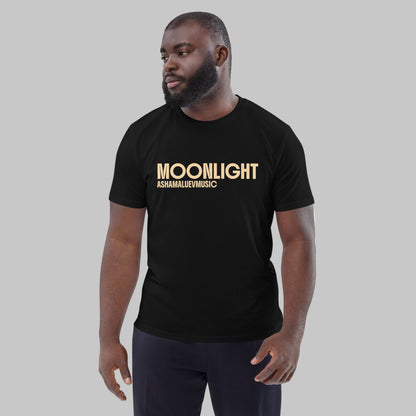 Man wearing a black organic cotton t-shirt with 'Moonlight' print and AShamaluevMusic logo on a light grey background