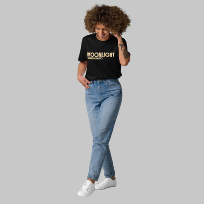 Woman wearing a black organic cotton t-shirt with 'Moonlight' print and AShamaluevMusic logo on a light grey background